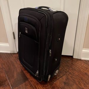 Travelpro 22” Crew 8 Rollaboard suitcase. Non-smoking home.